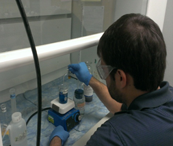 person testing water in lab