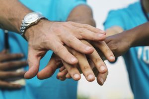image of hands joined together
