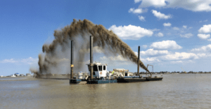 Dredged Sediment Being Distributed for Thin Layer Placement