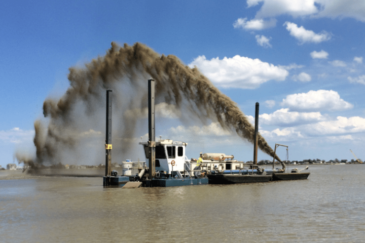 Dredged Sediment Being Distributed for Thin Layer Placement