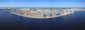 Aerial view of a Port America site showing cranes and stacked containers