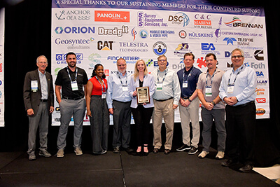 Photograph of the Team accepting the award at the WEDA conference.