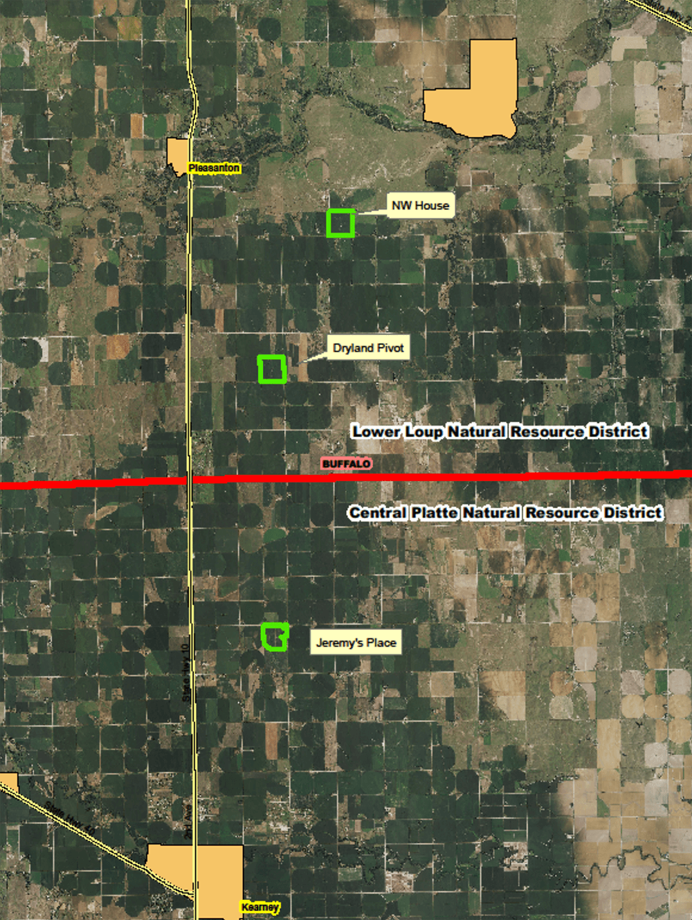 An aerial map with bold green outlines around three fields named NW House, Dryland Pivot, and Jeremy's Place, and a red boundary separating Lower Loup Natural Resources District and Central Platte Natural Resources District.
