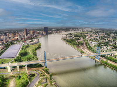 Aerial view of Lower Maumee River with Wayne Bridge in the foreground and City of Toledo Skyline in the background