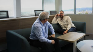 Two EA employees meeting in a collaboration space