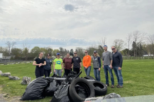 Image of EA volunteer with the trash they collected at the Earth Day Litter Cleanup event.
