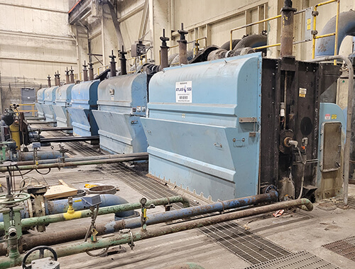Modified traveling water screen houses inside of a circulating water intake structure.