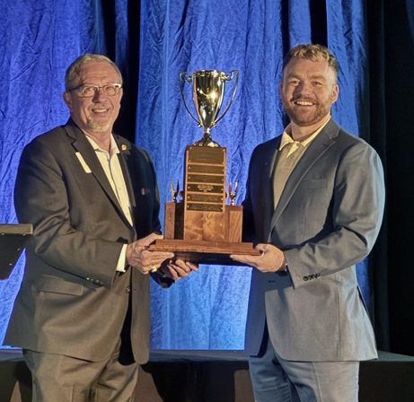 Robert Schlesinger, the Seattle Post President presents the Small Business Best Overall Project to EA Pacific Northwest Operations Manager Garrett Lee.