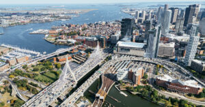 Aerial view of Boston with major roadways and bridges in the foreground