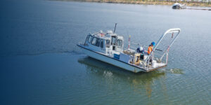EA sampling boat on the water with scientists on deck